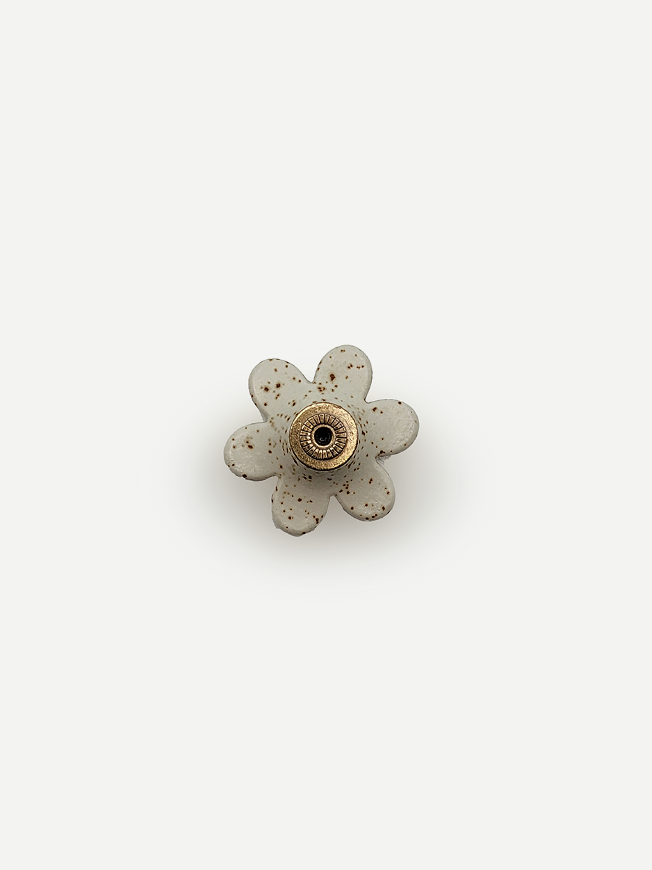 Handcrafted flower shape ceramic drawer knobs for bespoke cabinets.