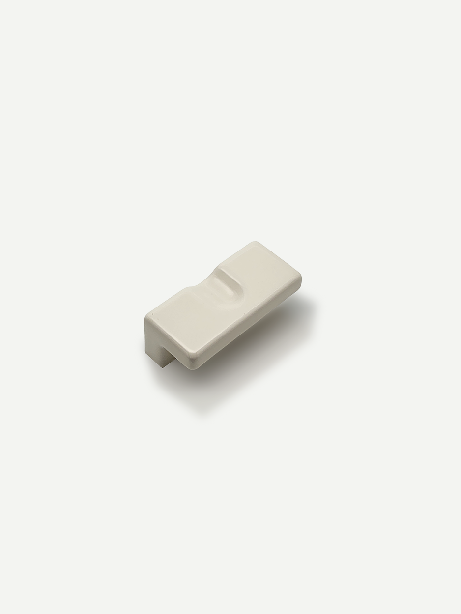 Designer ceramic cabinet knobs curated for luxury interiors in white.