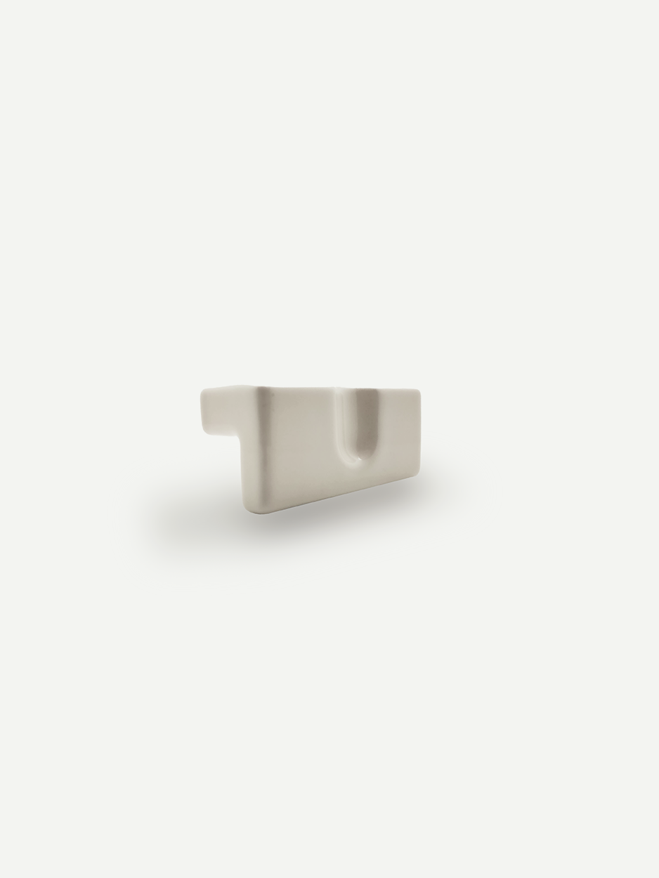 Minimal rectangle ceramic white knobs for contemporary bathroom vanity drawers.