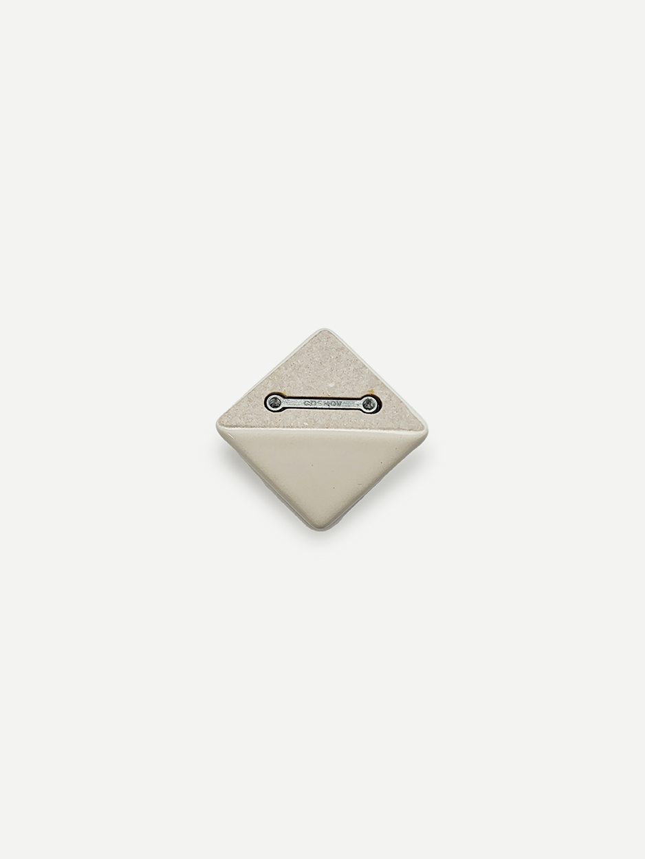 White ceramic knobs for curated interior design projects.