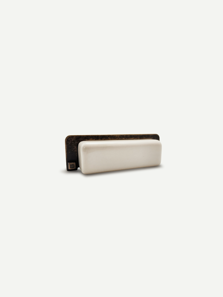 Designer white rectangular ceramic pulls for minimal luxury cabinets.