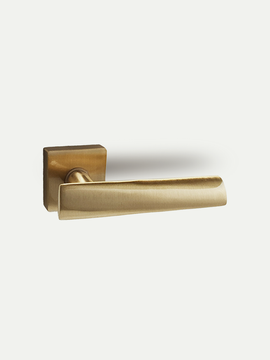 Modern brushed brass lever handle for luxury interior doors.