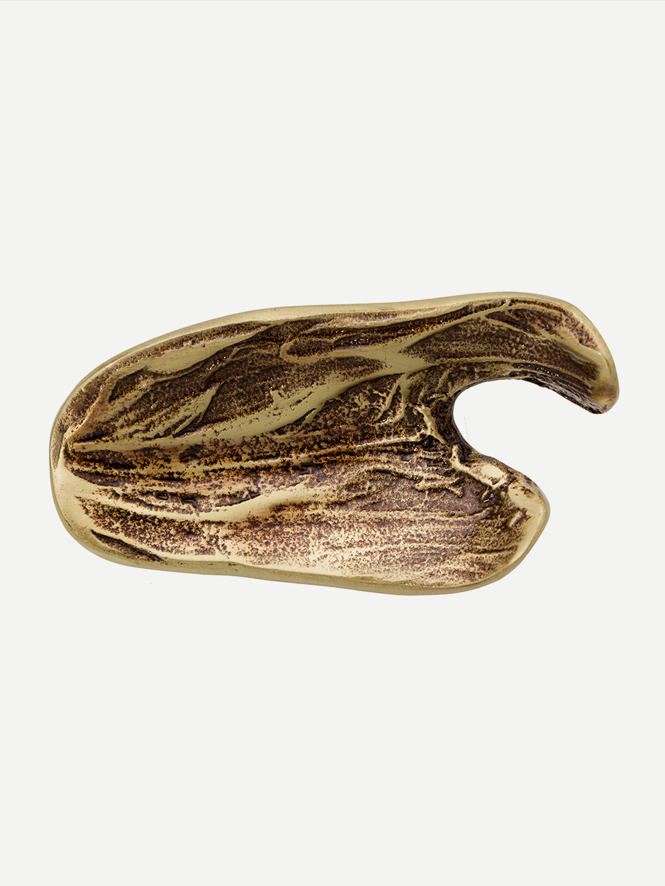 Sleek brass pull for modern furniture and interior design