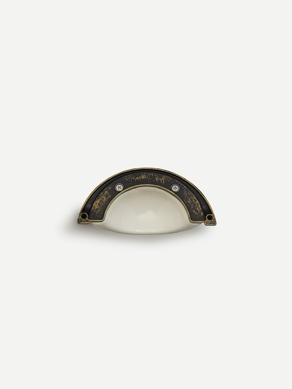 Half-round ceramic cabinet pull handle for modern dresser drawers.