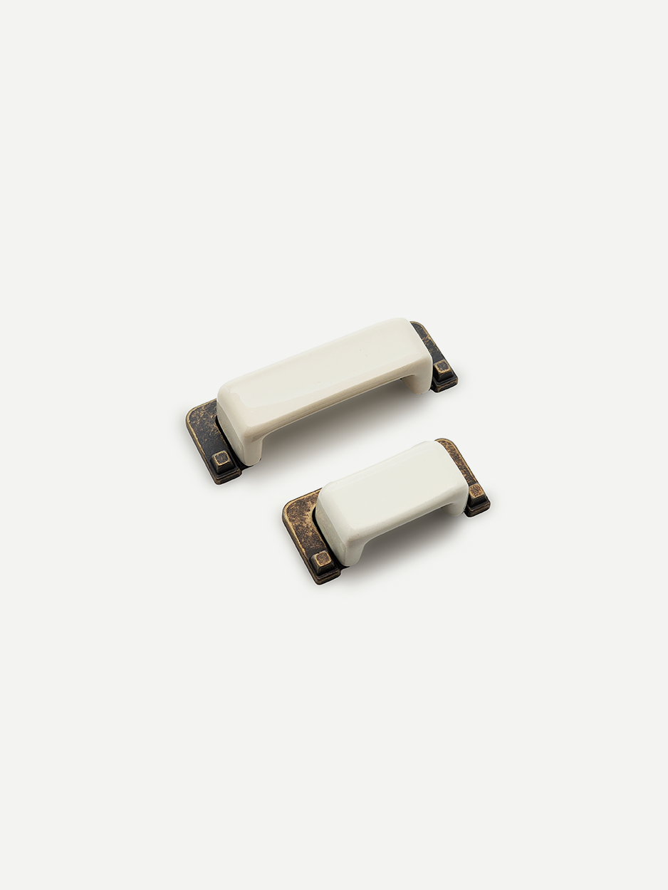 Modern white rectangular hardware for dresser drawers.