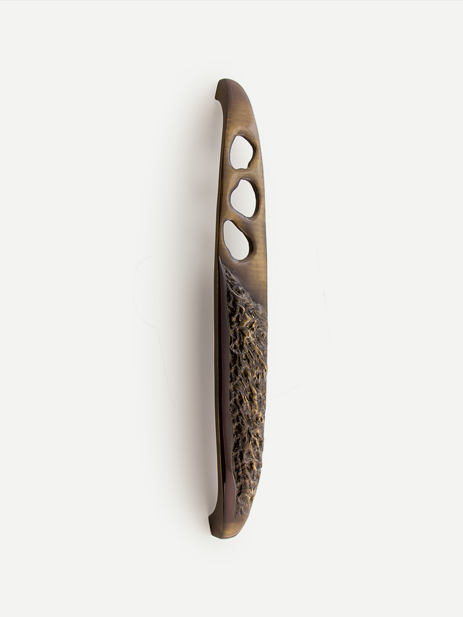 Front door handle set in aged bronze finish with texture 